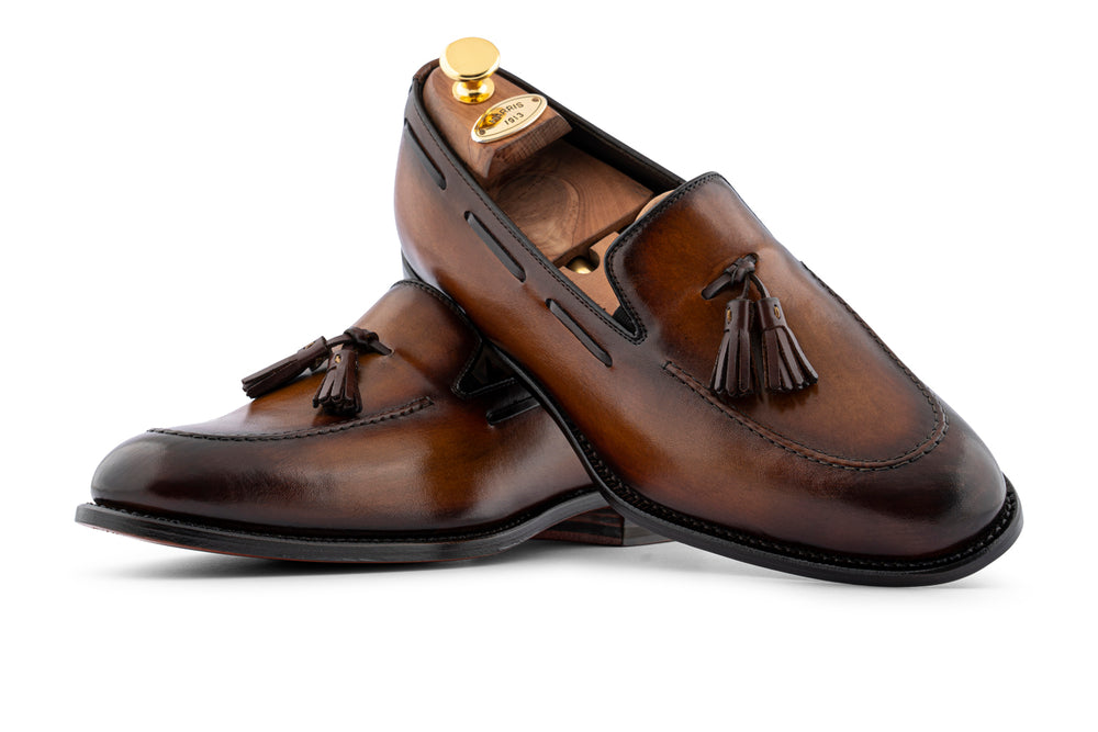 Mocassino in pelle dipinto a mano con pon pon