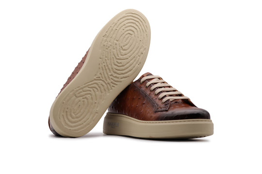 Sneakers in pelle stampata effetto struzzo