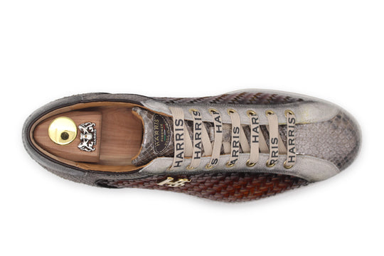 Zapatillas deportivas en piel tejida y pitón.