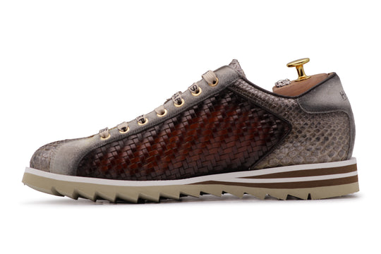 Zapatillas deportivas en piel tejida y pitón.