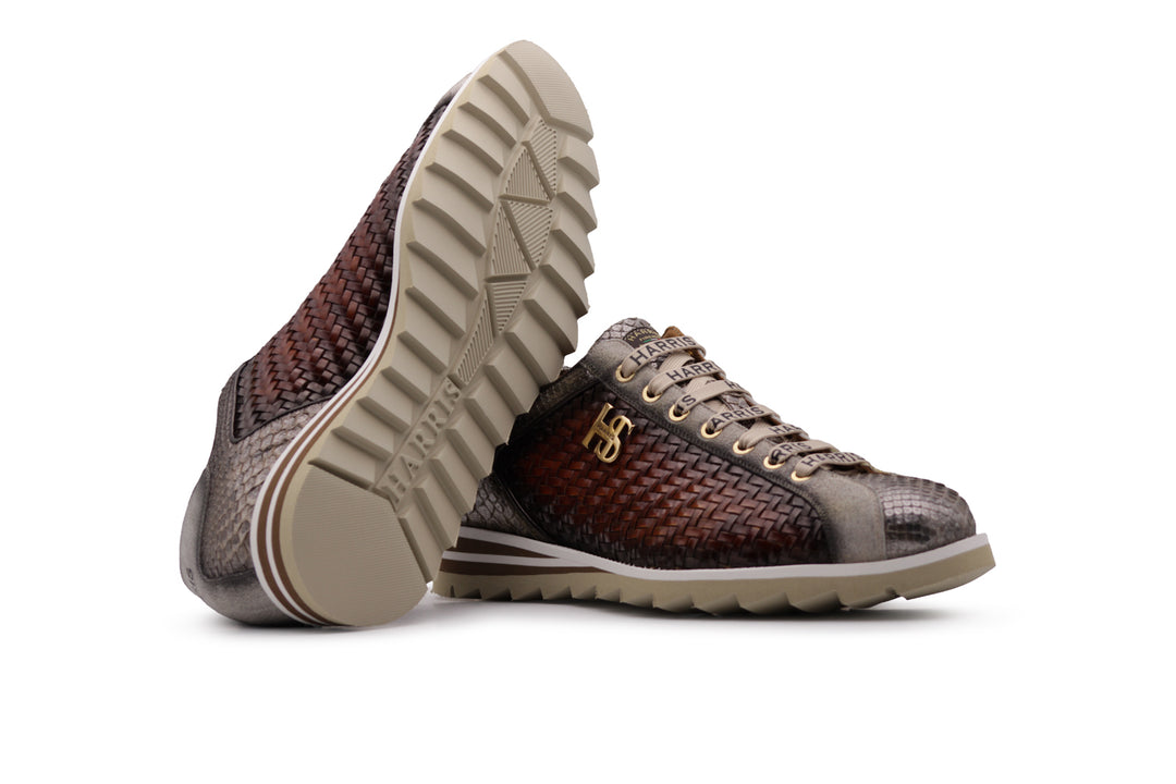 Zapatillas deportivas en piel tejida y pitón.